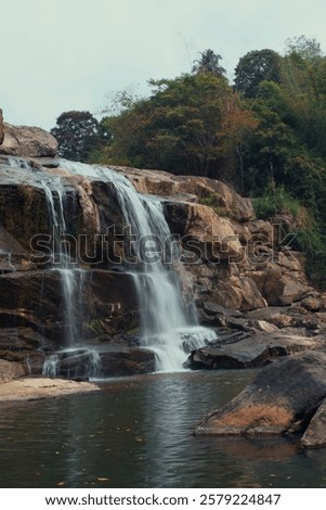 Similar – Image, Stock Photo Majestic waterfall in dark forest