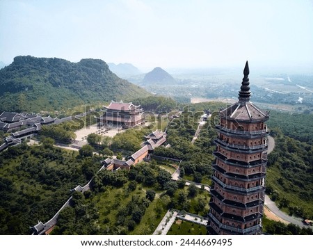 Similar – Image, Stock Photo Bai Dinh Tower Pagoda at the end of the winding road between the trees. . The biggest temple complex in Vietnam. Trang An, Nim Binh.