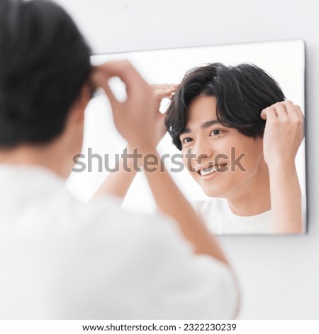 Similar – Image, Stock Photo Man touching the heads of wheat in a cultivated field