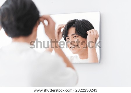 Similar – Image, Stock Photo Man touching the heads of wheat in a cultivated field