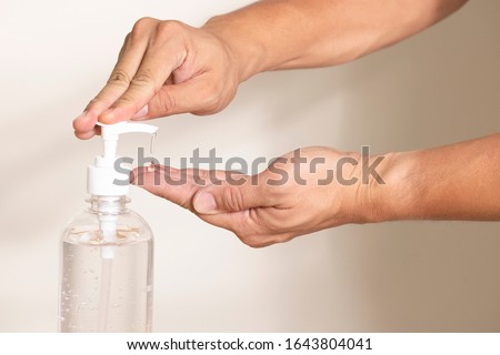 Similar – Image, Stock Photo Using Hand sanitizer on working desk