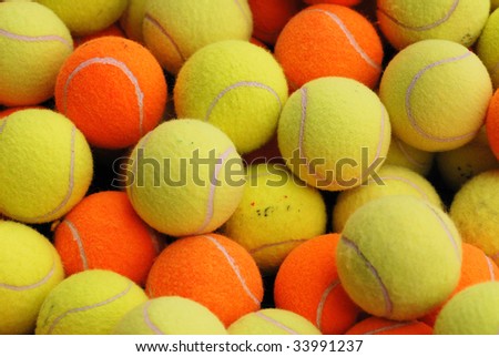 Background of wore out tennis balls in a sport center,
