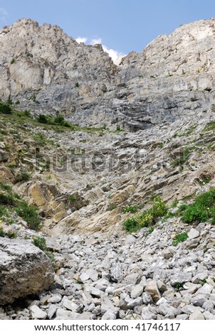 Rockslide under steep cliff in cory pass, banff national park, alberta, canada