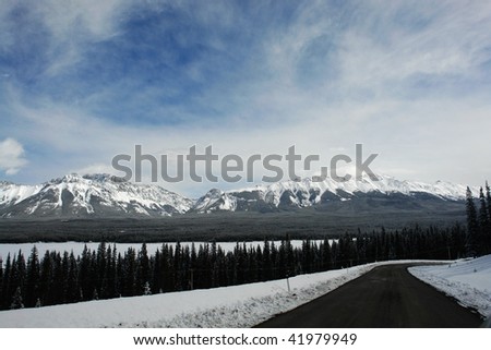 View of canadian rocky mountains in spring while driving along the highway 40 in the kananaskis country, alberta, canada