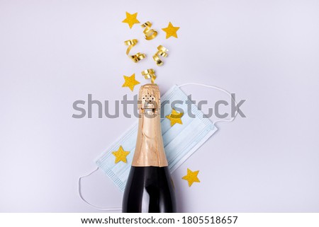 Image, Stock Photo Bottle of champagne face mask and glasses with gold glitter on pink background. Party decor. Christmas, birthday or wedding concept. Flat lay. Festive, drink. New year 2021 celebration.