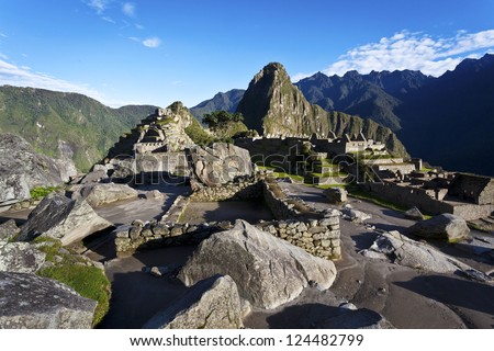 Early morning at the lost old Inca city  Machu Picchu in the Andes mountains in Peru. With a view at the Wayna Picchu mountain in the back.