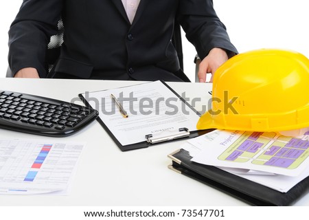 yellow construction helmet on the table builder. Isolated on white background