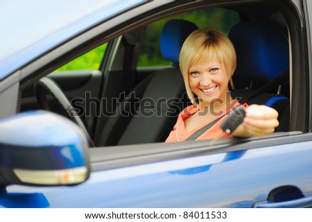 portrait  smiling young woman in the car
