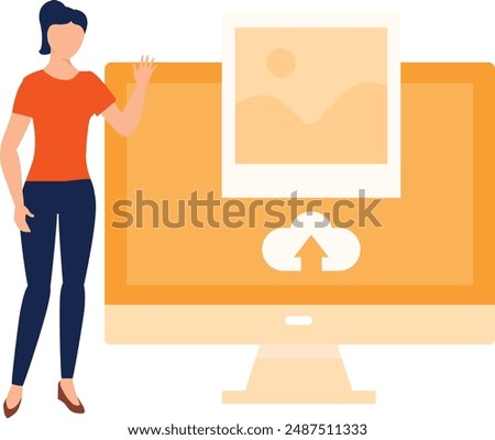 The girl is uploading images on monitor.