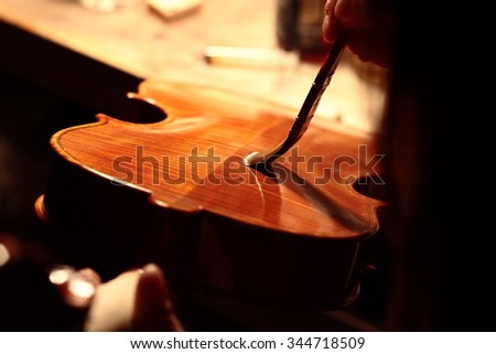 Similar – Image, Stock Photo Craftsman with violin in professional workshop