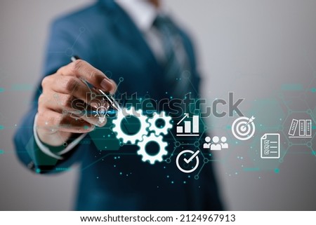In the hands of a businessman, a virtual innovation. Business Process and Problem Solving, Workflow Monitoring and Evaluation as well as Quality Control are all part of Operations Management. 商業照片 © 