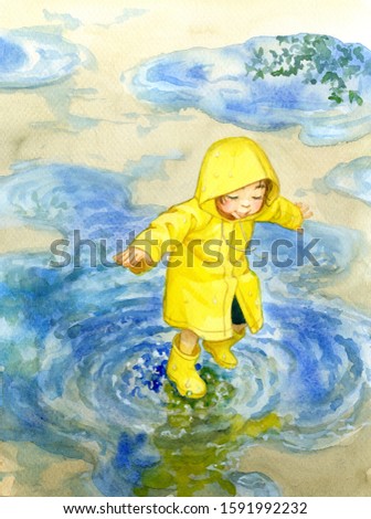 A little girl stepping in a puddle