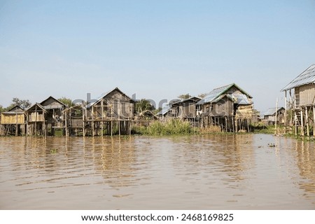 Similar – Foto Bild Haus auf Stelzen am See in der Nähe der Berge