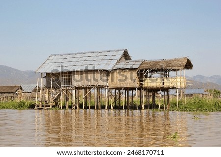 Similar – Foto Bild Haus auf Stelzen am See in der Nähe der Berge