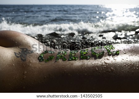 tanned woman lying on the beach with the word \