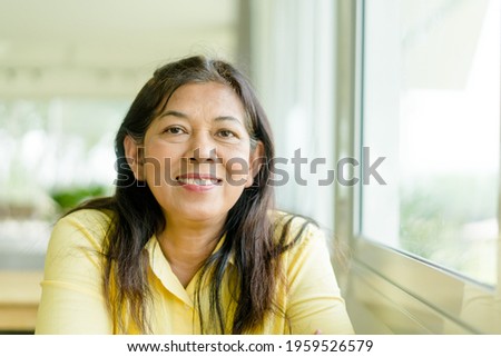 Similar – Image, Stock Photo Senior woman with face mask looking out of window at home