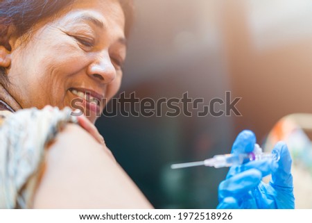 Vaccine medical.Asian indian old women getting vaccinated immunity in clinic.vaccine program, recommended inoculation, vaccination, vaccine volunteer or vaccinated patient.Coronavirus. india old woman