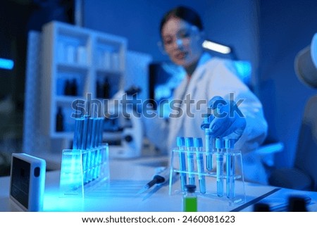 Similar – Image, Stock Photo Scientist examining test samples through microscope
