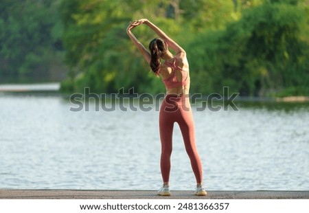 Similar – Image, Stock Photo Young woman stretching arms before working out on street