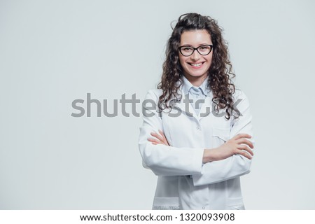 Similar – Image, Stock Photo medic woman in white coat and blue latex gloves holding a syringe, white studio background