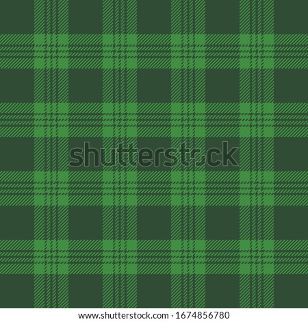 St. Patricks day tartan plaid. Scottish pattern in green and black cage. Scottish cage. Traditional Scottish checkered background. Seamless fabric texture. Vector illustration Stok fotoğraf © 