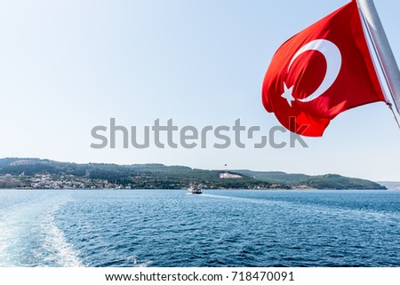 Turkish flag and Dur Yolcu memorial on background in Kilitbahir District,Canakkale,Turkey.TURKEY, Canakkale,18 August 2017 Stok fotoğraf © 