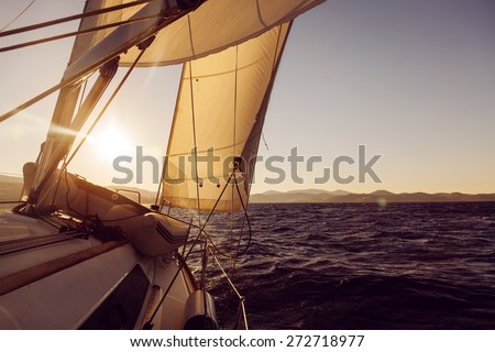 Sailboat crop during the regatta at sunset ocean, instagram toning