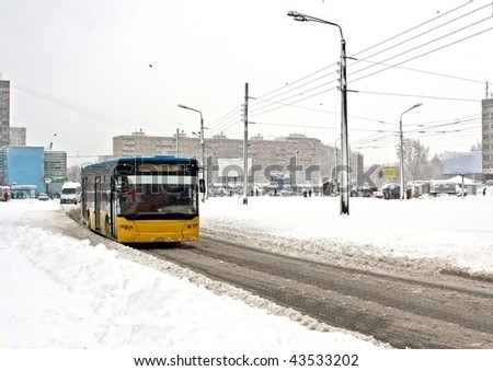 City bus moving on winter road