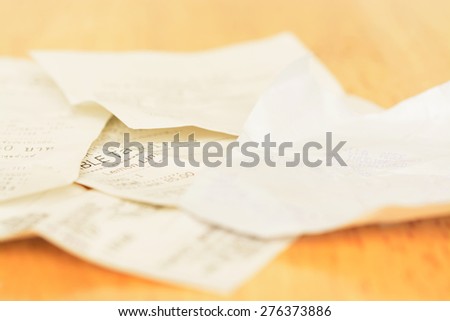 Assort billing receipt on table