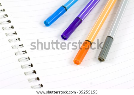 Blank white notepad with color pen