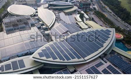 Aerial view of a solar panel photovoltaic with reflection on building roof top. Part of reduce reuse and restore, Renewable energy concept Stock foto © 