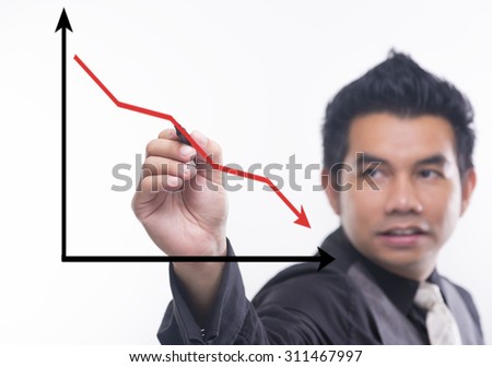 Young business man draws a ascending graph chart