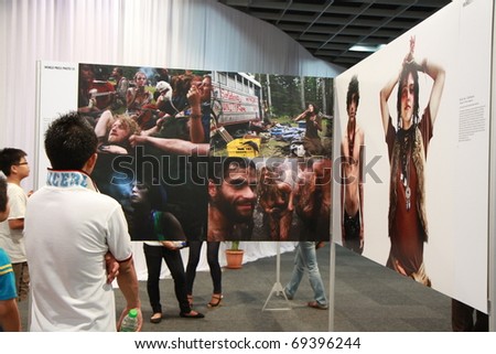 KUALA LUMPUR - JANUARY 21: A visitor admiring a photo at The World Press Photo Exhibition on January 21, 2011 in Kuala Lumpur, Malaysia. The gallery of best press photographer were shows here.