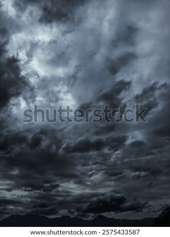 Similar – Image, Stock Photo thick grey clouds of smoke surrounded by glowing sparks
