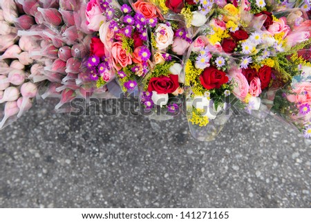 Bunches of different varieties of colorful rose flowers