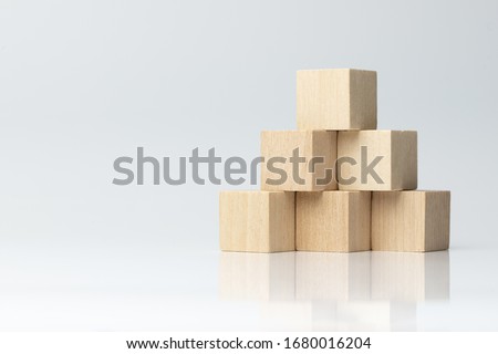 Six wooden blocks arranged in pyramid shape isolated on white background Stock foto © 