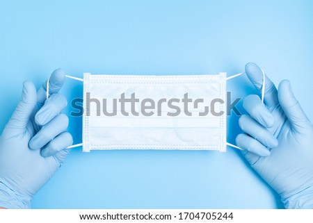 Similar – Image, Stock Photo hands wearing blue gloves holding culture dish