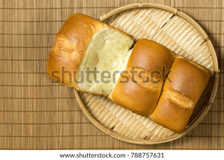 Similar – Foto Bild Drei Sauerteigbrötchen flachgelegt mit Mohn und Sesam auf einer Serviette auf einem Holzhocker