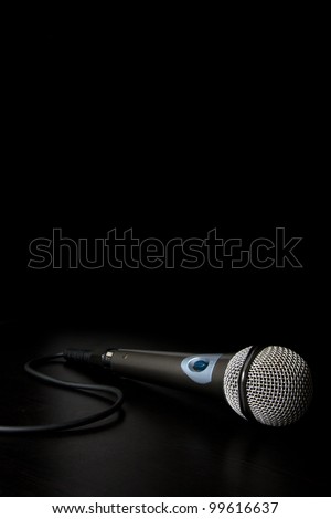 Microphone with cable isolated over a back background