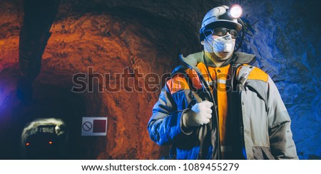 Similar – Image, Stock Photo Miner in the mine. Well-uniformed miner inside mine raising thumb
