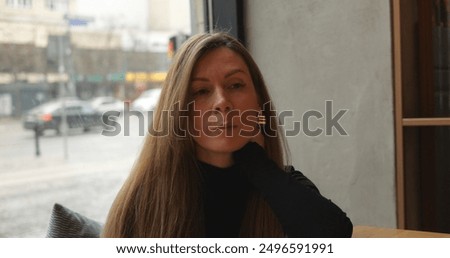 Similar – Image, Stock Photo Lonely woman with long hair looking at a hill