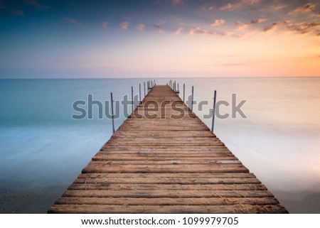 sunset pier wit clouds in the sea of minimalism ストックフォト © 
