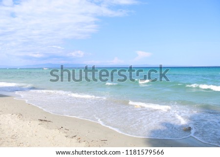 Beautiful Mediterranean sea shore in Greece at summer time. Amazing clear water and wild beach.