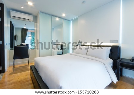 luxury white bedroom in apartment.