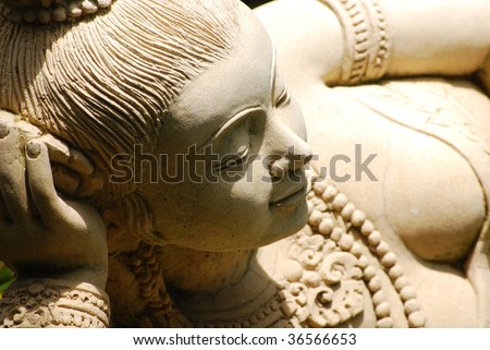 Stone sculpture of an asian lady