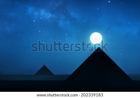 Ancient pyramids at night - night sky filled with stars