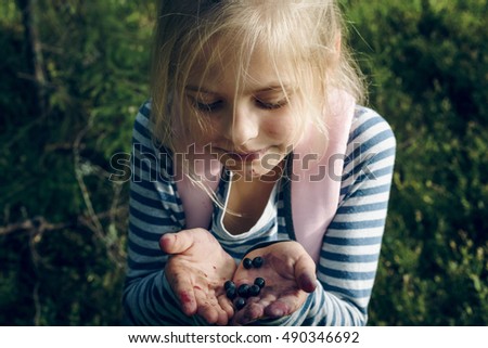 Similar – Image, Stock Photo Picking wild blueberries in the forest