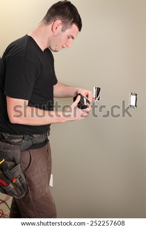An Electrician working on a new construction site