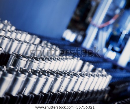 close up of a capacitor production machine