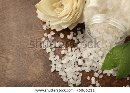 close-up of bath salt spilled on a wooden surface